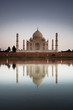 Taj Mahal reflected in river at twilight