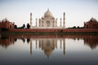 Taj Mahal reflected in river at twilight