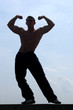 Muscular Man Showing His Biceps Muscular Man Showing His Biceps