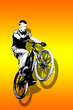 MTB bike jump on vivid orange background