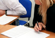 Foto: Woman with pen listen on the office meeting Woman with pen listen on the office meeting