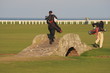 golf players at st andrews swilken bridge