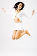 Young happy female jumping