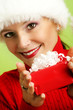 smiling woman with a christmas gift
