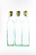 Three empty glass bottles isolated on white