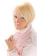 Blond girl in pink jacket isolated on white