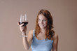 Woman looking at wine glass