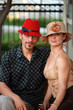 Stylish young couple in beautiful designer hats.