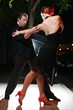 Couple dancing on a street at night. Couple dancing on a street at night.