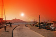 Sunset over Naoussa harbor - Paros island, Greece Sunset over Naoussa harbor - Paros island, Greece