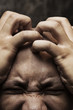 man having painful headache