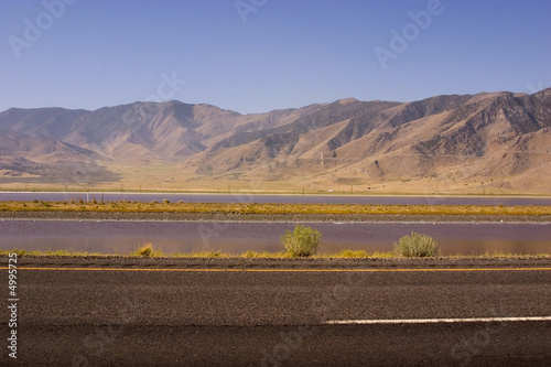 Photo: Highway with Mountains on the Background Highway with Mountains on the Background
