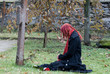 Gothic girl with a rose on a cemetery Gothic girl with a rose on a cemetery