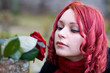Closeup of redhead girl with a rose Closeup of redhead girl with a rose