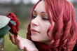 Closeup of redhead girl with a rose Closeup of redhead girl with a rose