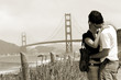 Foto: Young couple with Golden Gate bridge, San Francisco Young couple with Golden Gate bridge, San Francisco