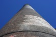 A very tall chimney looking up against a deep blue sky A very tall chimney looking up against a deep blue sky