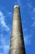 A Tall Chimney Against A Deep Blue Sky A Tall Chimney Against A Deep Blue Sky