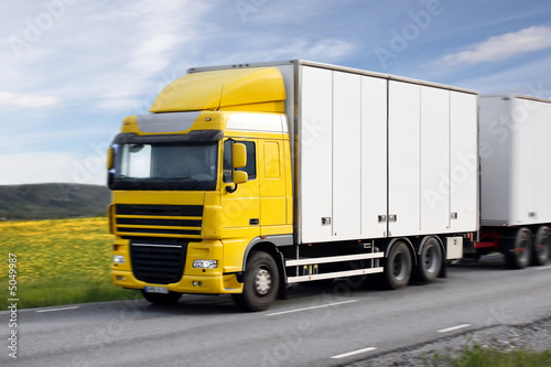 Photo: truck driving on country-road truck driving on country-road