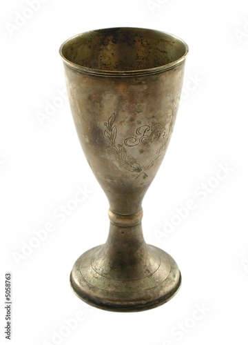 Photo: Old metal cup with monogram, isolated on white. Old metal cup with monogram, isolated on white.