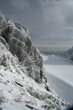 High mountain slope. Rock, snow and sky. 
