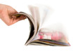 Hand which is thumbing magazine Hand which is thumbing magazine