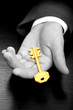Image : Businessman holding the business gold key