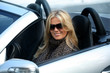 Photo: Blond girl in a car Blond girl in a car