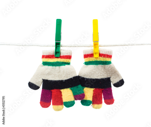 Photo: two kid gloves on clothes line two kid gloves on clothes line