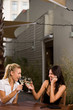 women drinking wine