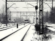 Railway track with train in winter. Black and white