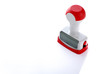  Plastic stamp over white paper