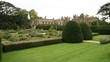 view of garden in front of castle & church