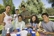 Family Gathered Around Picnic Table