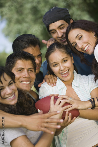 Photo: Group of young people playing football. Group of young people playing football.