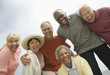 Photo: Group of friends laughing, outdoors, low angle view Group of friends laughing, outdoors, low angle view