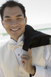 Groom smiling outdoors, close-up, portrait