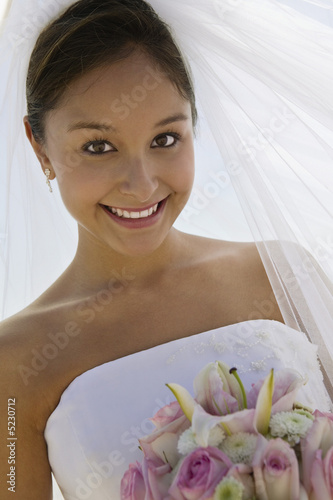 Photo: Bride With Bouquet on Beach Bride With Bouquet on Beach