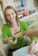 Young woman Paying for Clothes with Credit Card