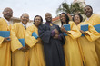 Photo: Preacher and Choir in church garden, portrait, low angle view Preacher and Choir in church garden, portrait, low angle view