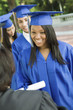 Graduate shaking hand of dean outside