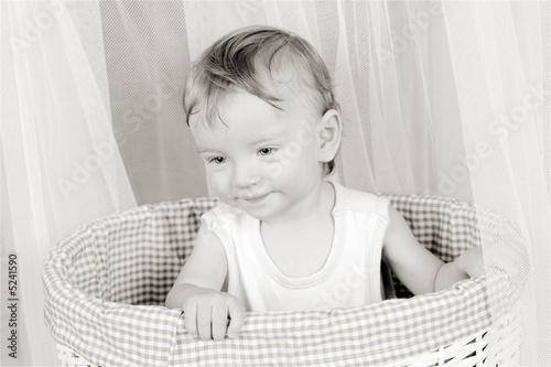 Photo: Boy in basket Boy in basket