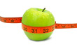 Fresh green apple with red measuring tape and water drops