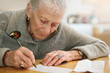 Senior woman writing Senior woman writing