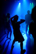 Dancing people in an underground club