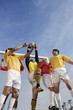 Soccer Players Competing for the Ball