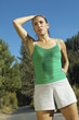 Female jogger pausing for breath on path
