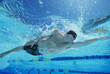 Man Swimming in Pool