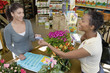 Woman making purchase at plant nursery