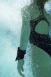 Woman coming up for air, underwater